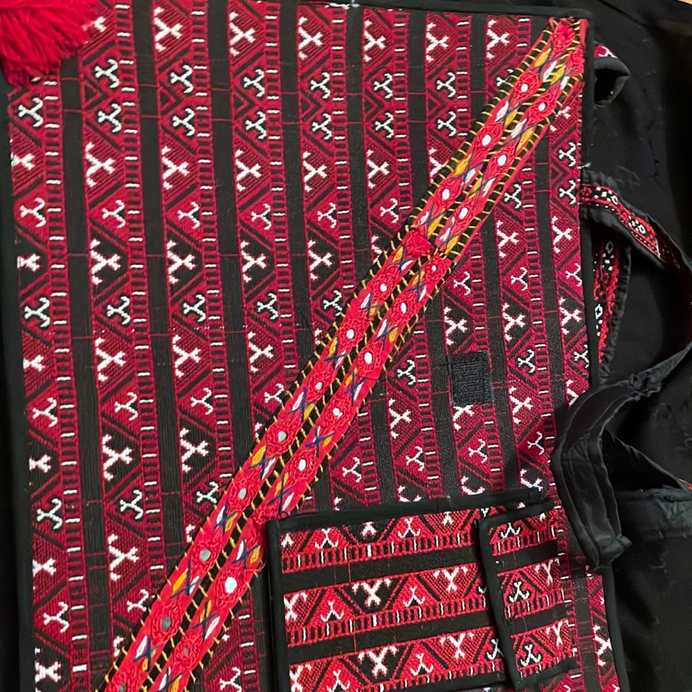 Black, white and red. Handmade woven pattern.